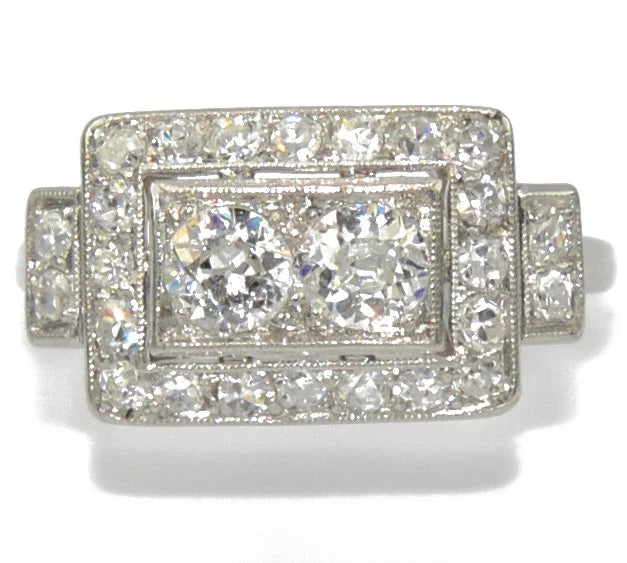Platinum ring with a rectangular-cut diamond