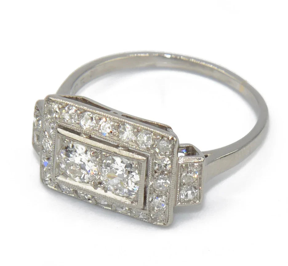 Platinum ring with a rectangular-cut diamond