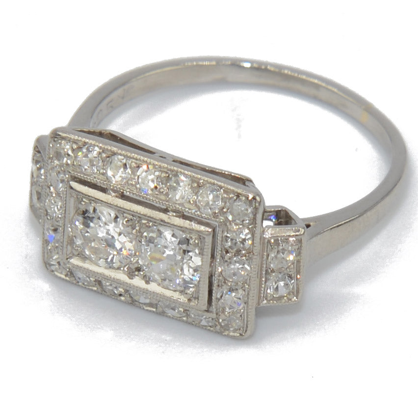 Platinum ring with a rectangular-cut diamond