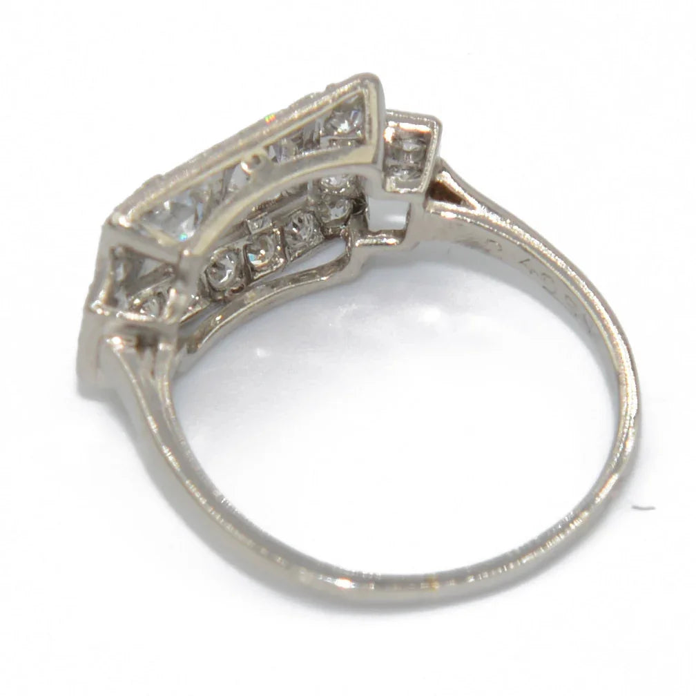 Platinum ring with a rectangular-cut diamond