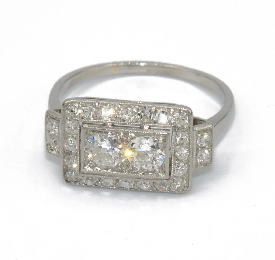 Platinum ring with a rectangular-cut diamond
