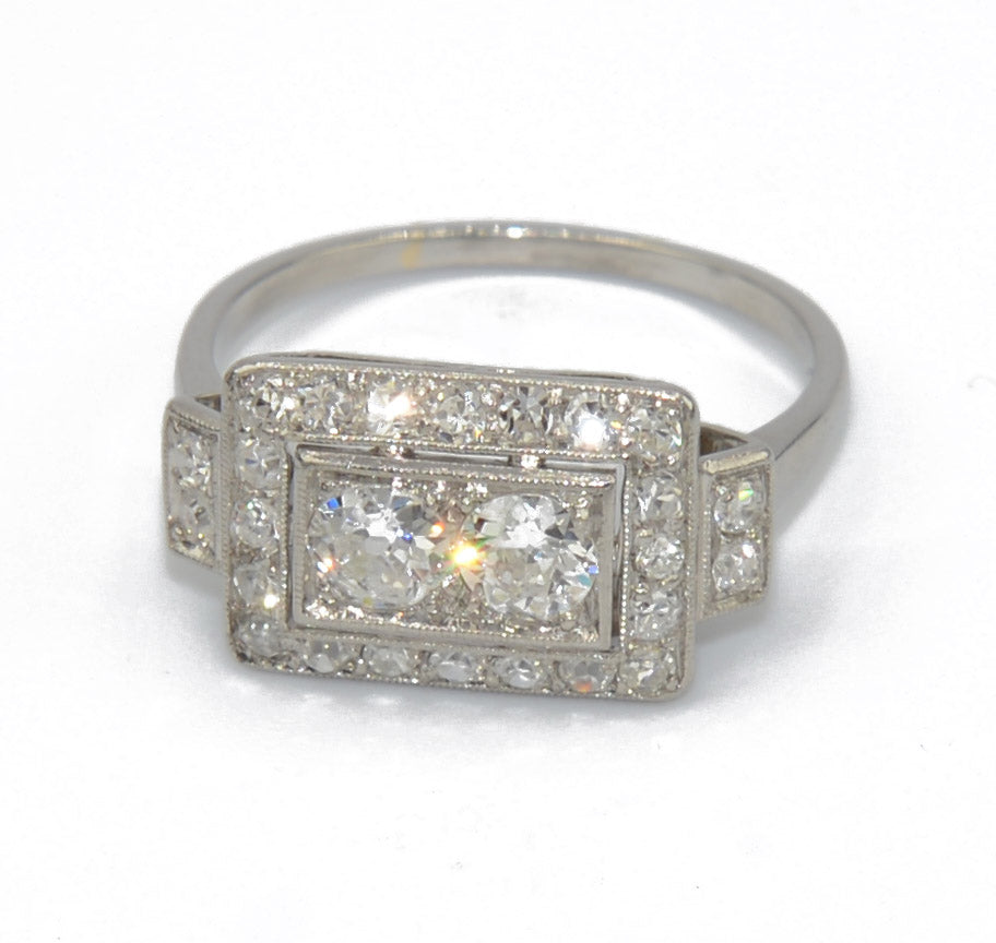 Platinum ring with a rectangular-cut diamond