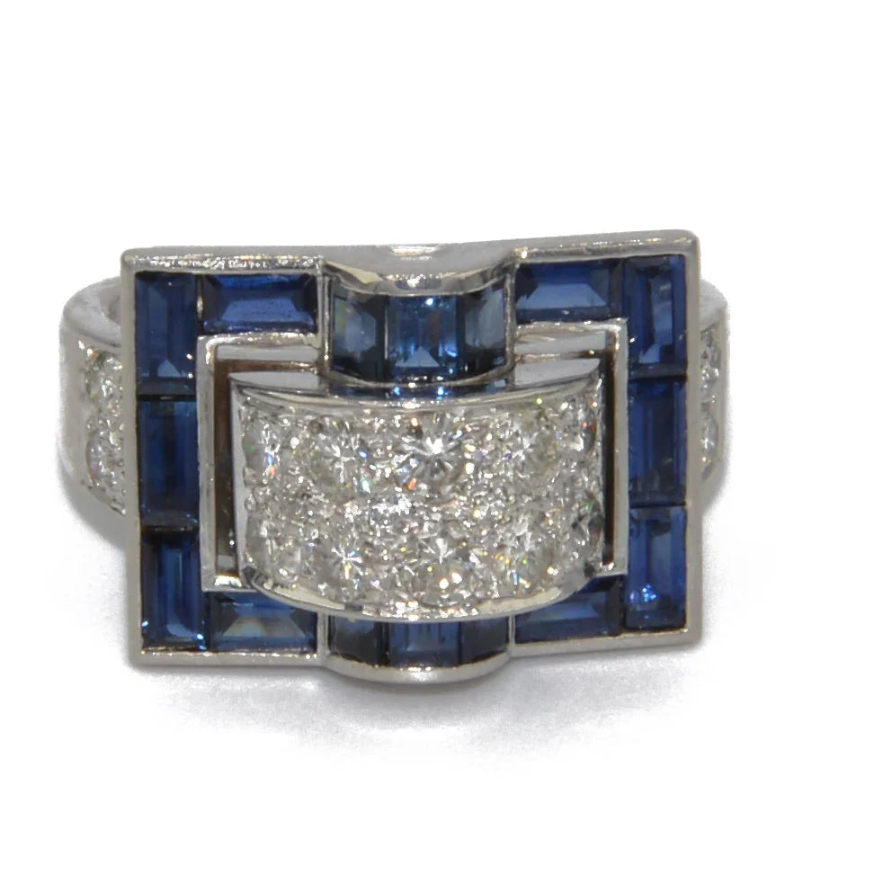 White gold ring with calibrated blue sapphires
