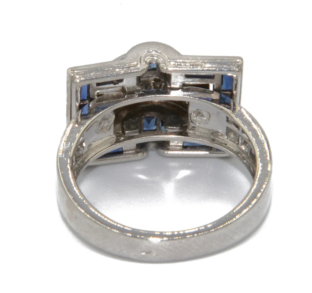 White gold ring with calibrated blue sapphires