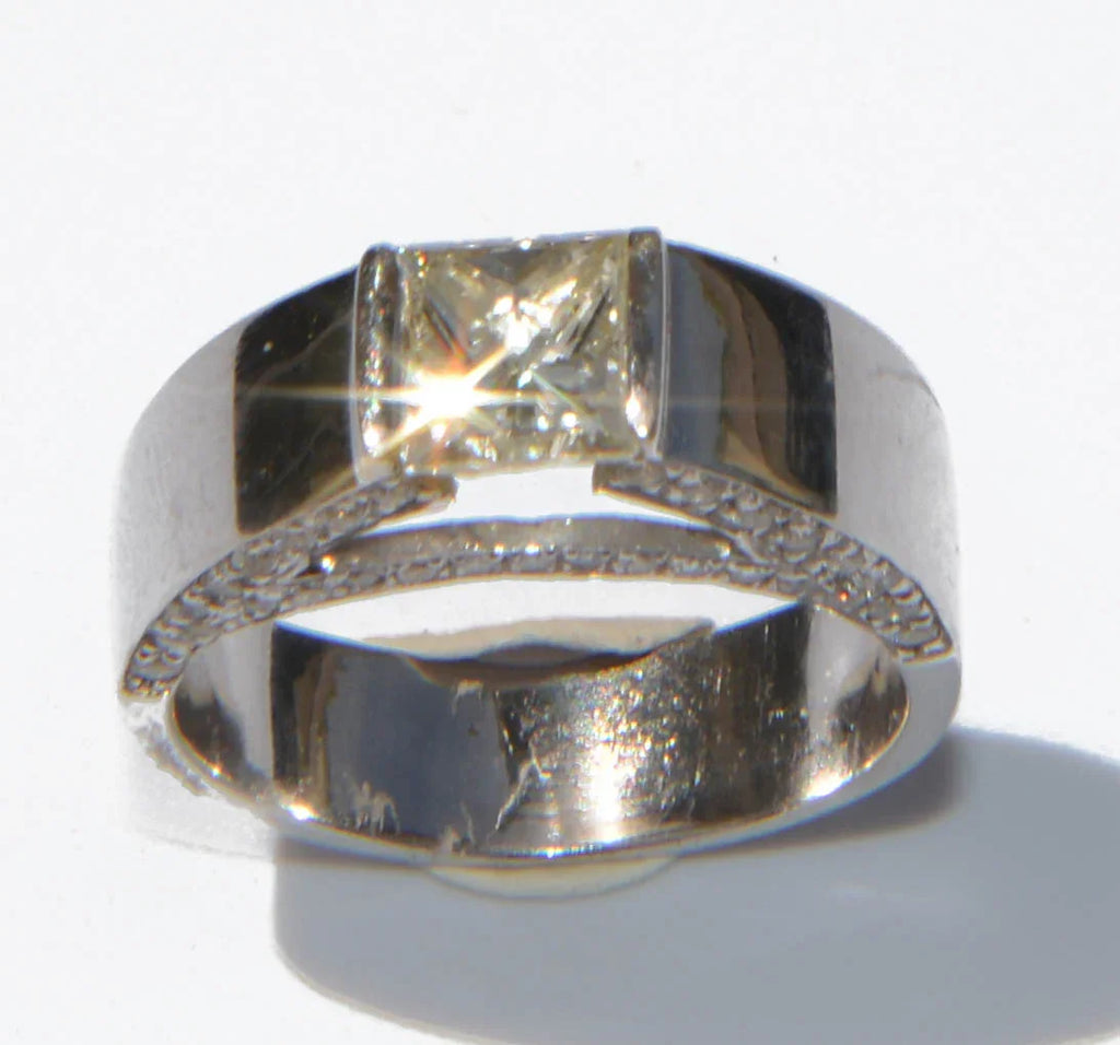 White gold solitaire ring with a princess-cut diamond
