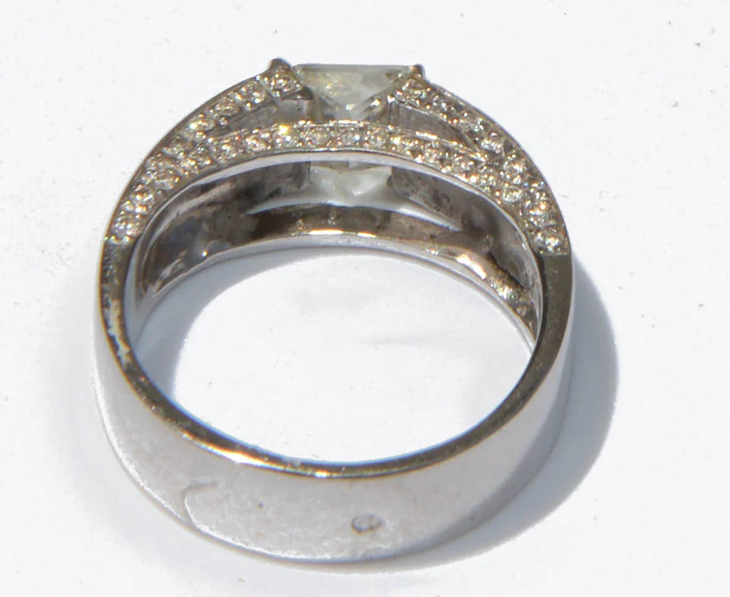 White gold solitaire ring with a princess-cut diamond