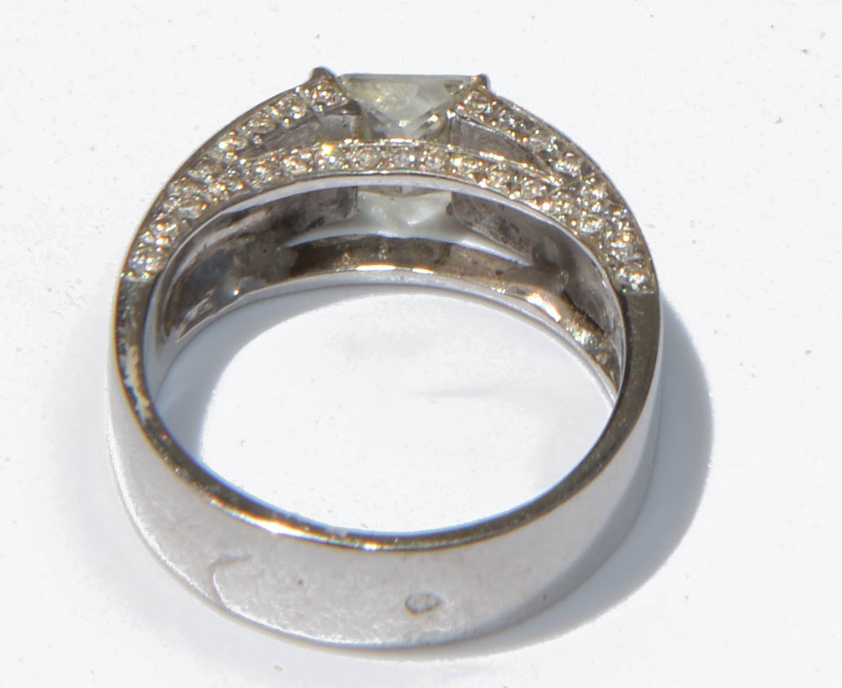 White gold solitaire ring with a princess-cut diamond
