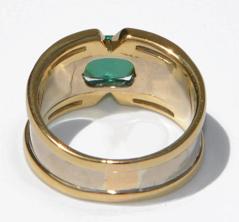 Yellow gold bangle ring adorned with a Tourmaline on a baguette diamond cascade