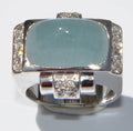 Platinum ring set with an aquamarine cabochon