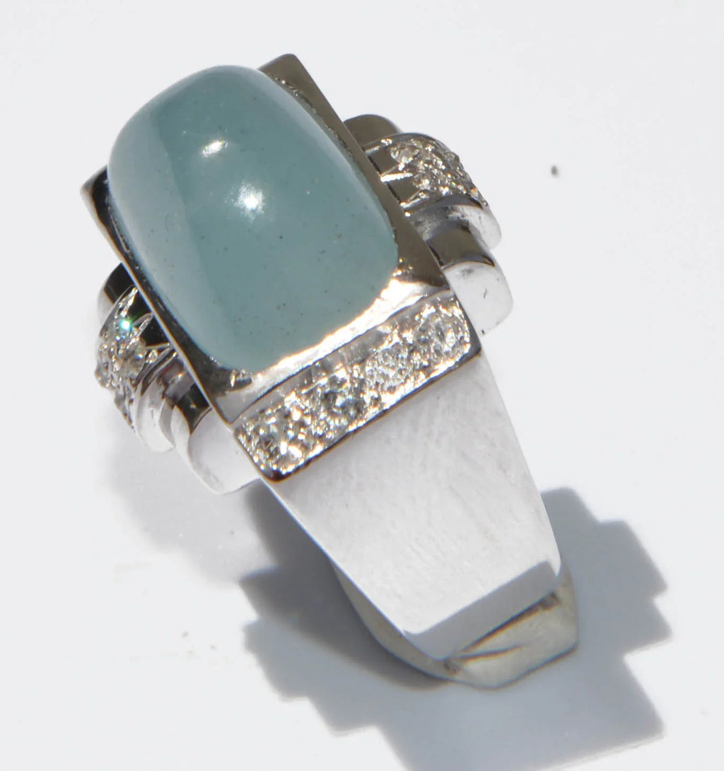 Platinum ring set with an aquamarine cabochon