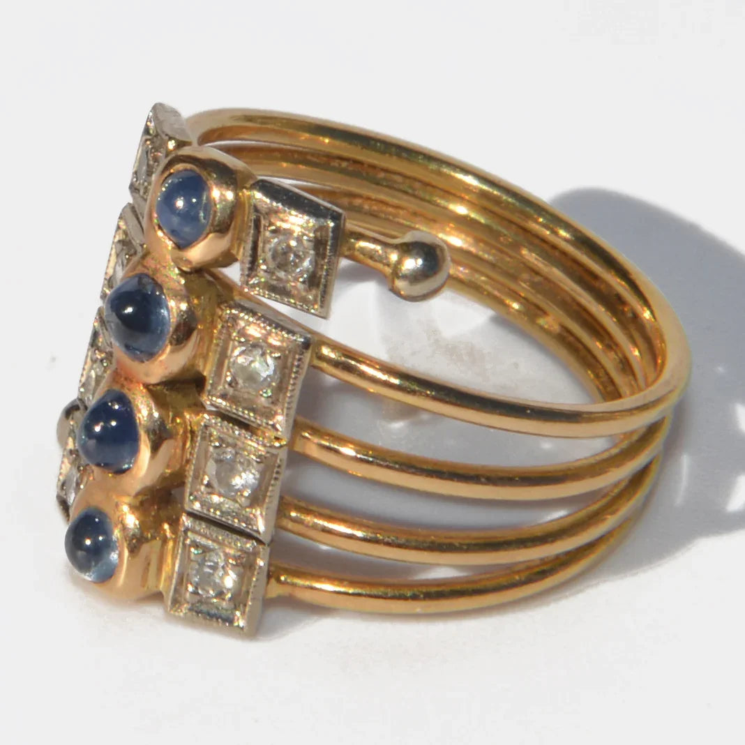 1910 yellow gold ring with cabochon sapphires and diamonds