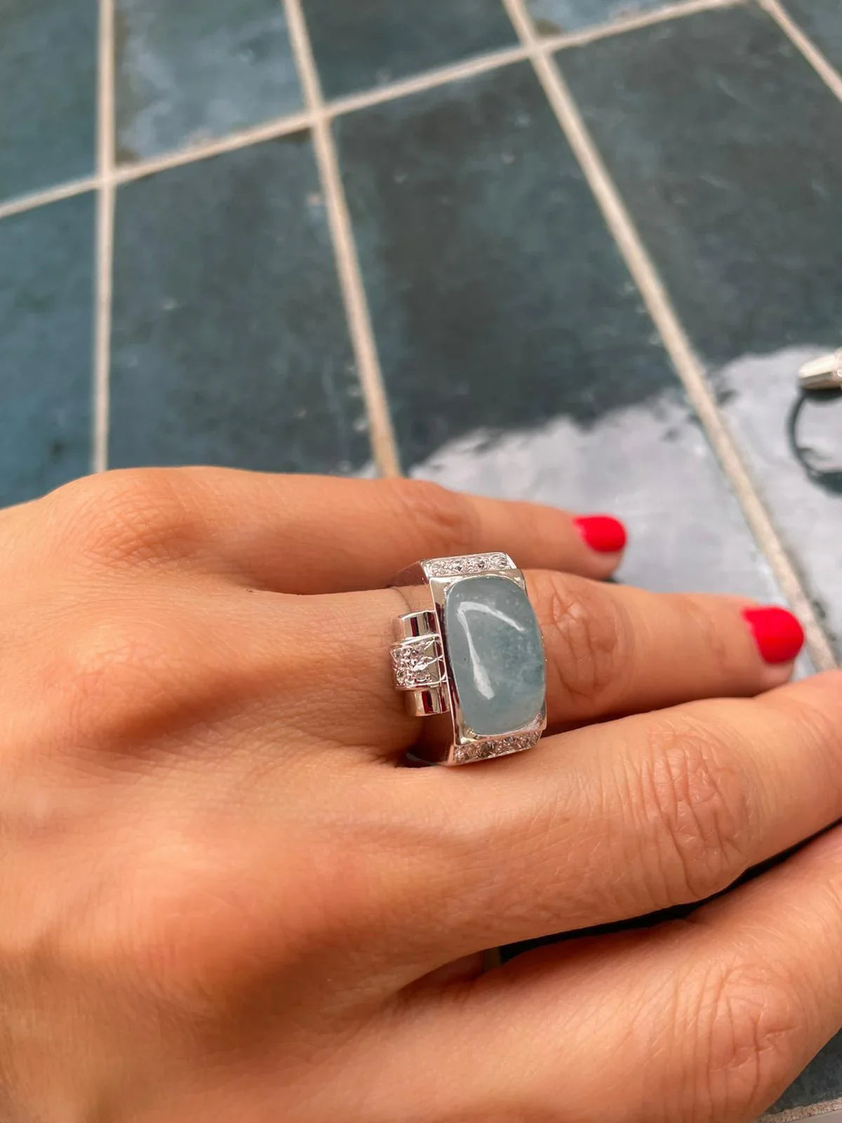 Platinum ring set with an aquamarine cabochon
