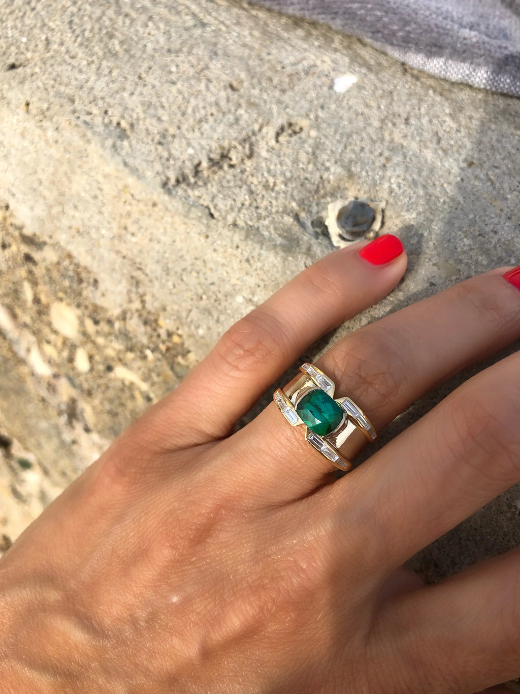 Yellow gold bangle ring adorned with a Tourmaline on a baguette diamond cascade