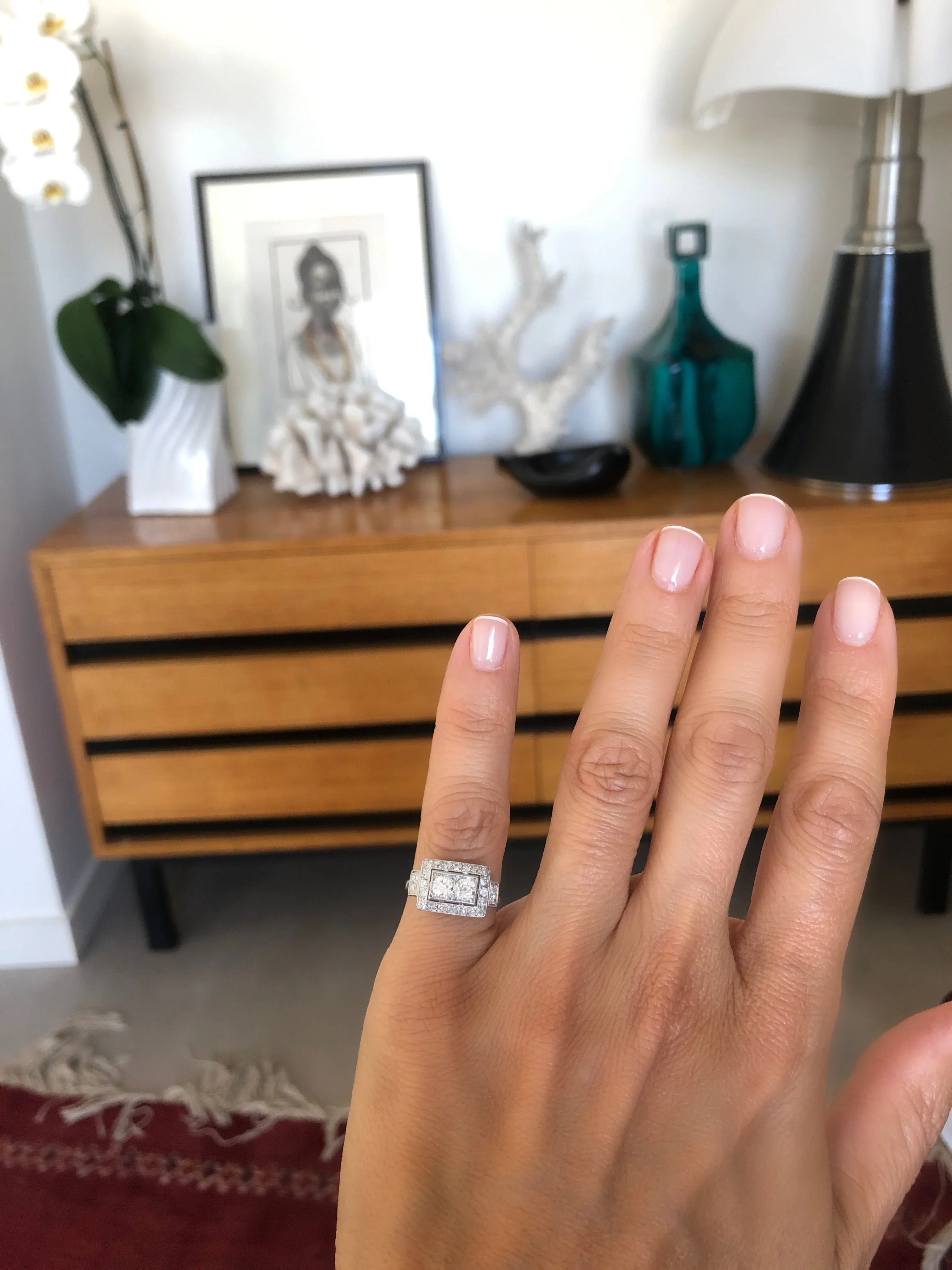 Platinum ring with a rectangular-cut diamond