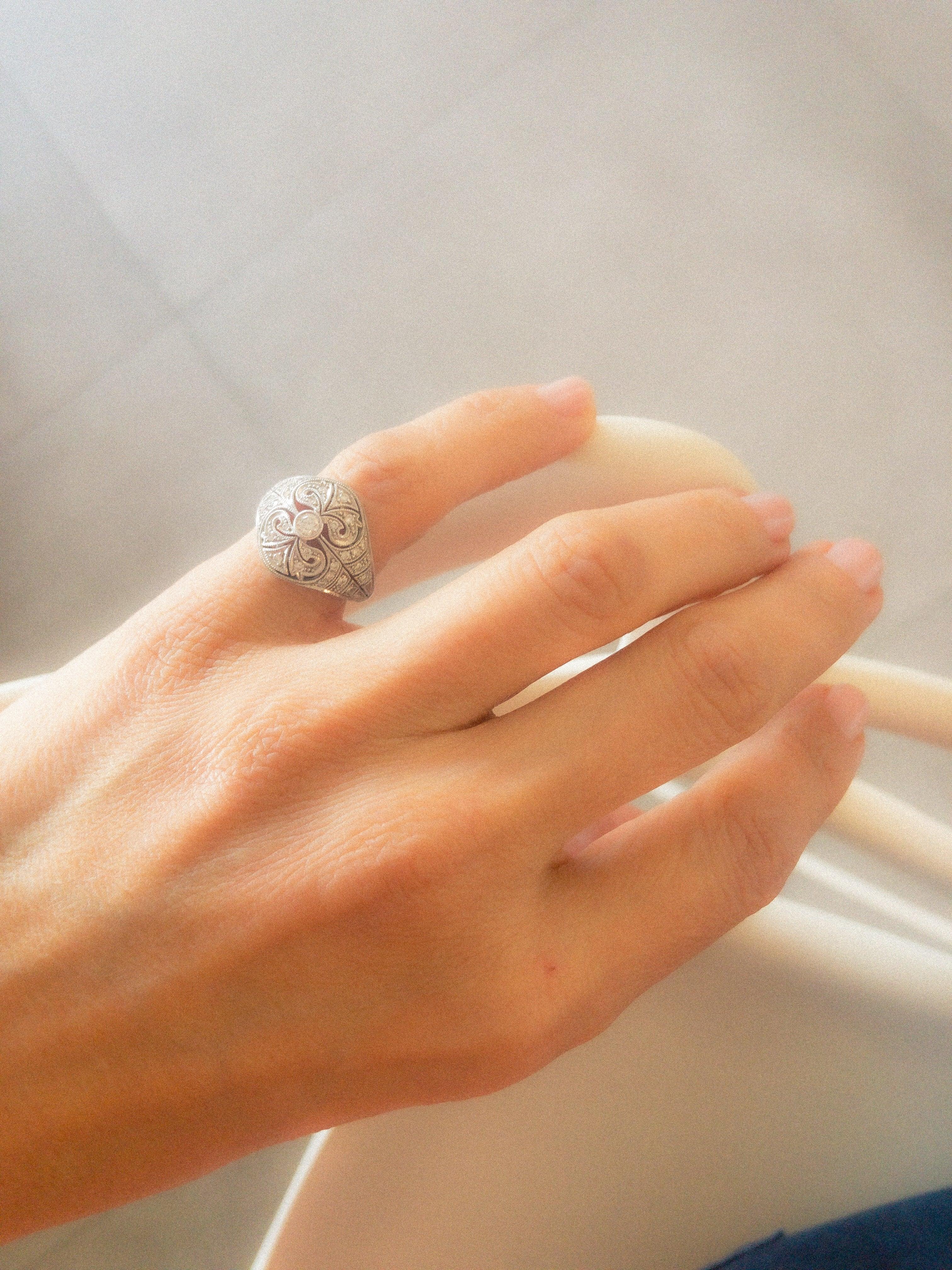 Carved gray gold and diamond dome ring