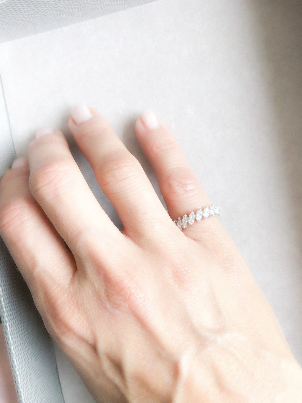 White gold and diamond half eternity ring