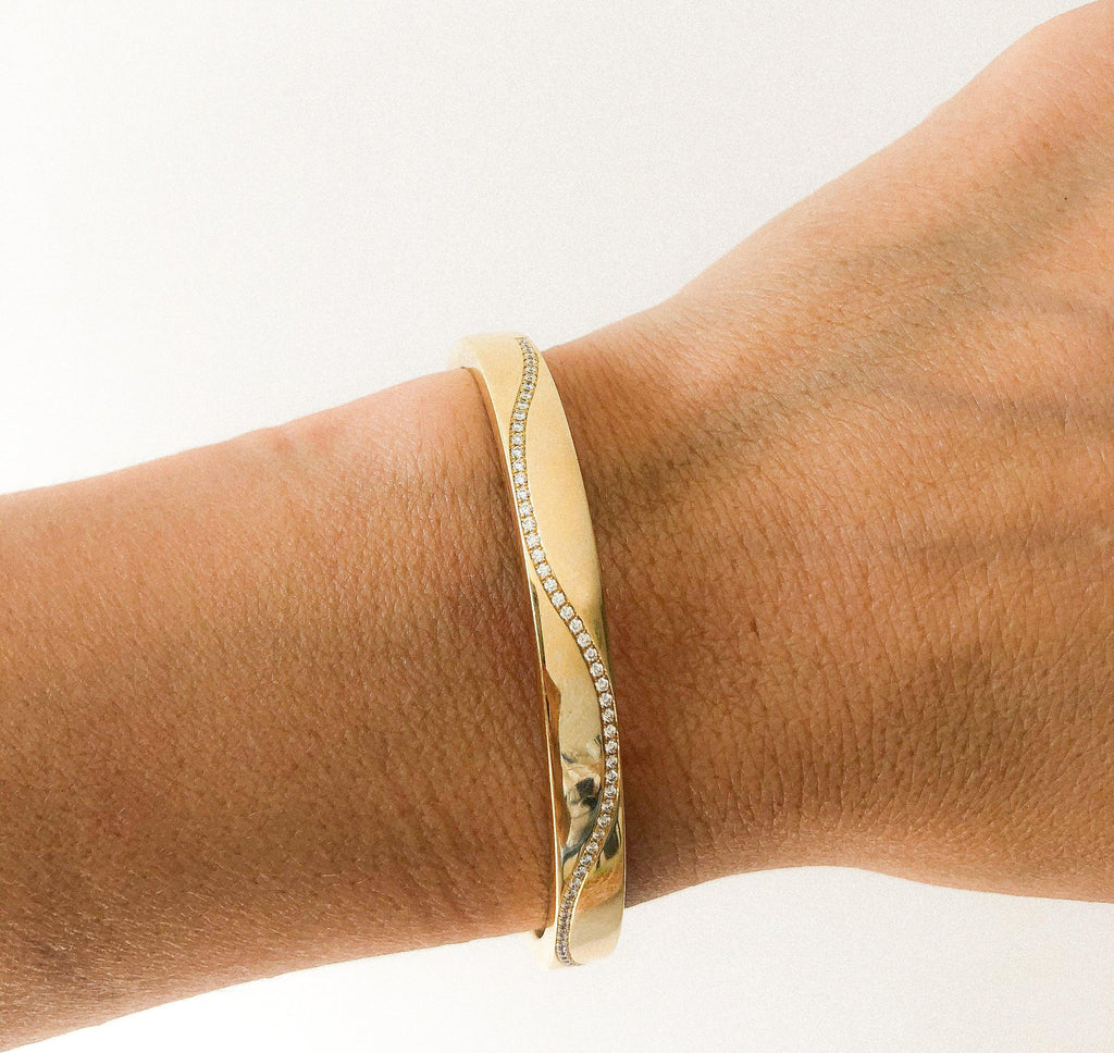 Yellow gold and diamond hinged bangle bracelet