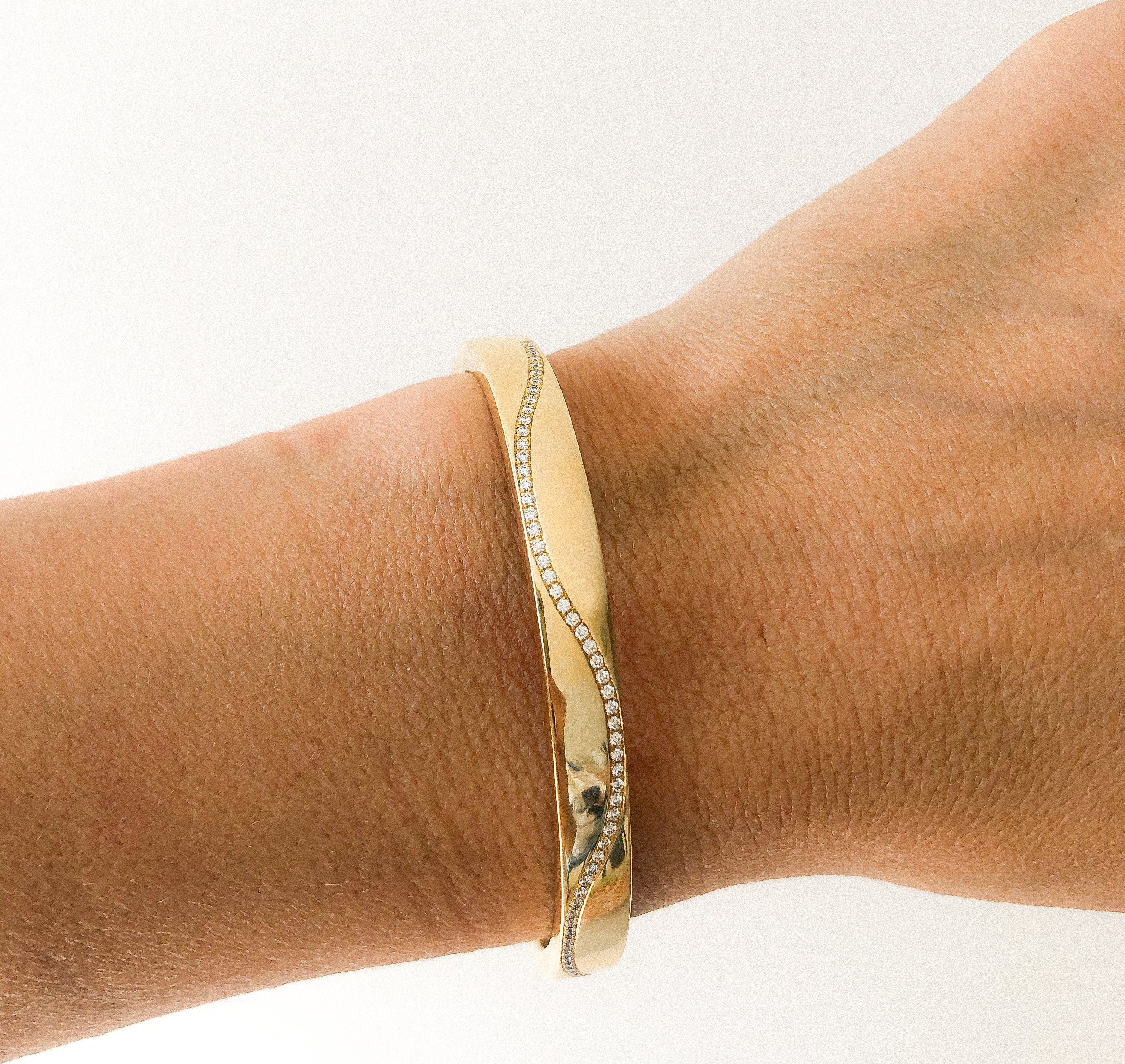 Yellow gold and diamond hinged bangle bracelet