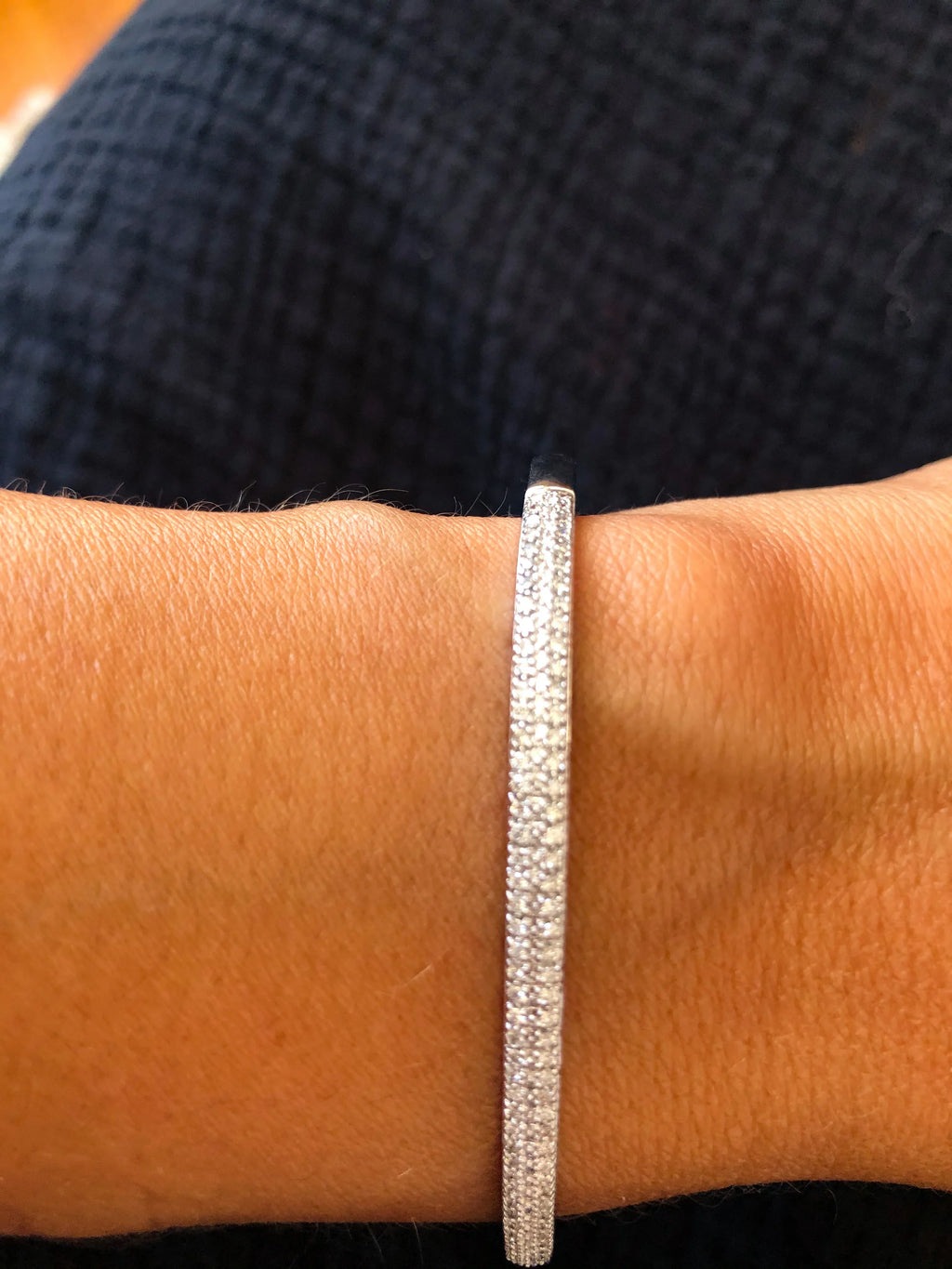 Rigid white gold diamond-set hinged bracelet