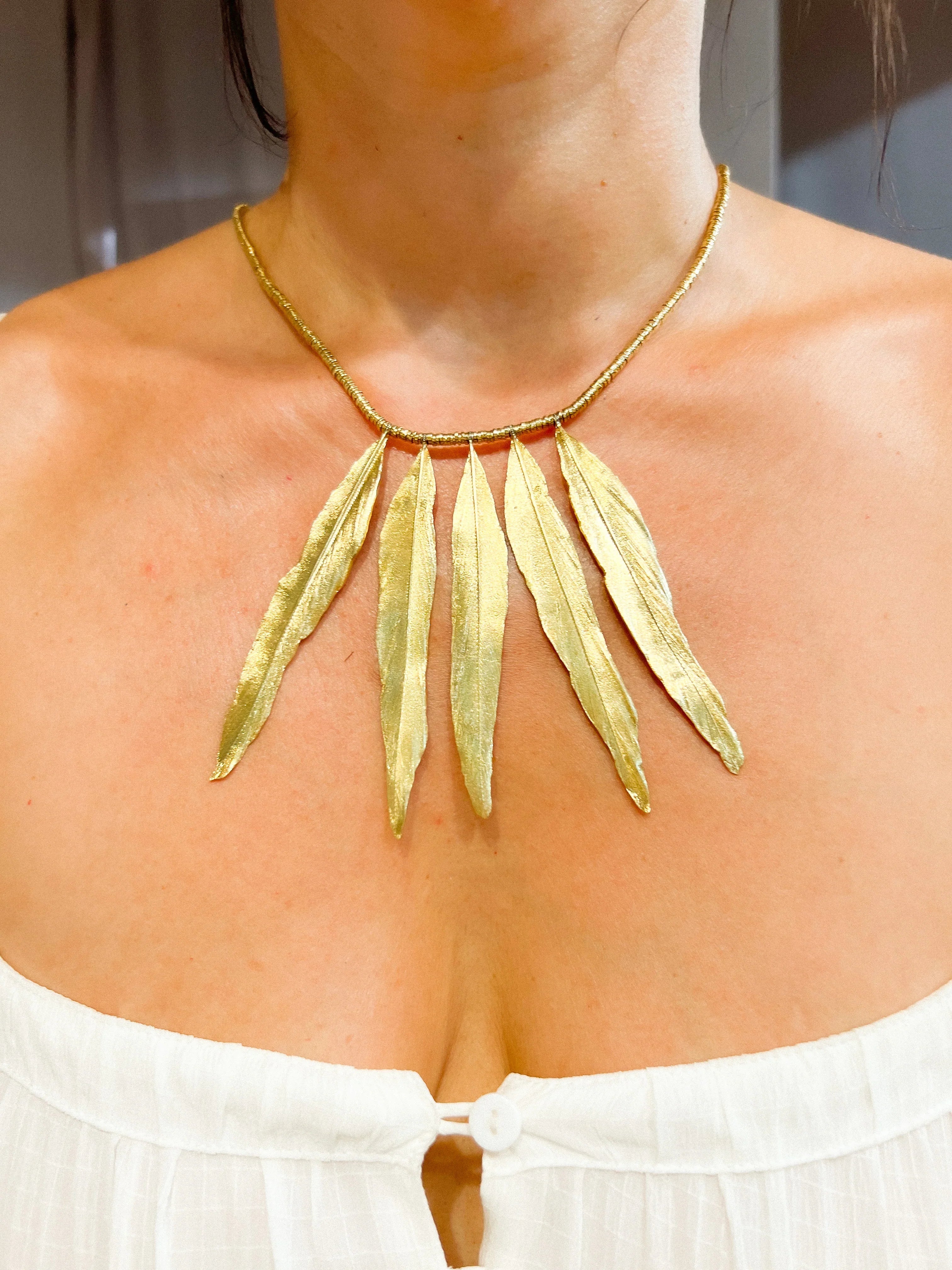 H.Stern gold necklace forming gold feathers