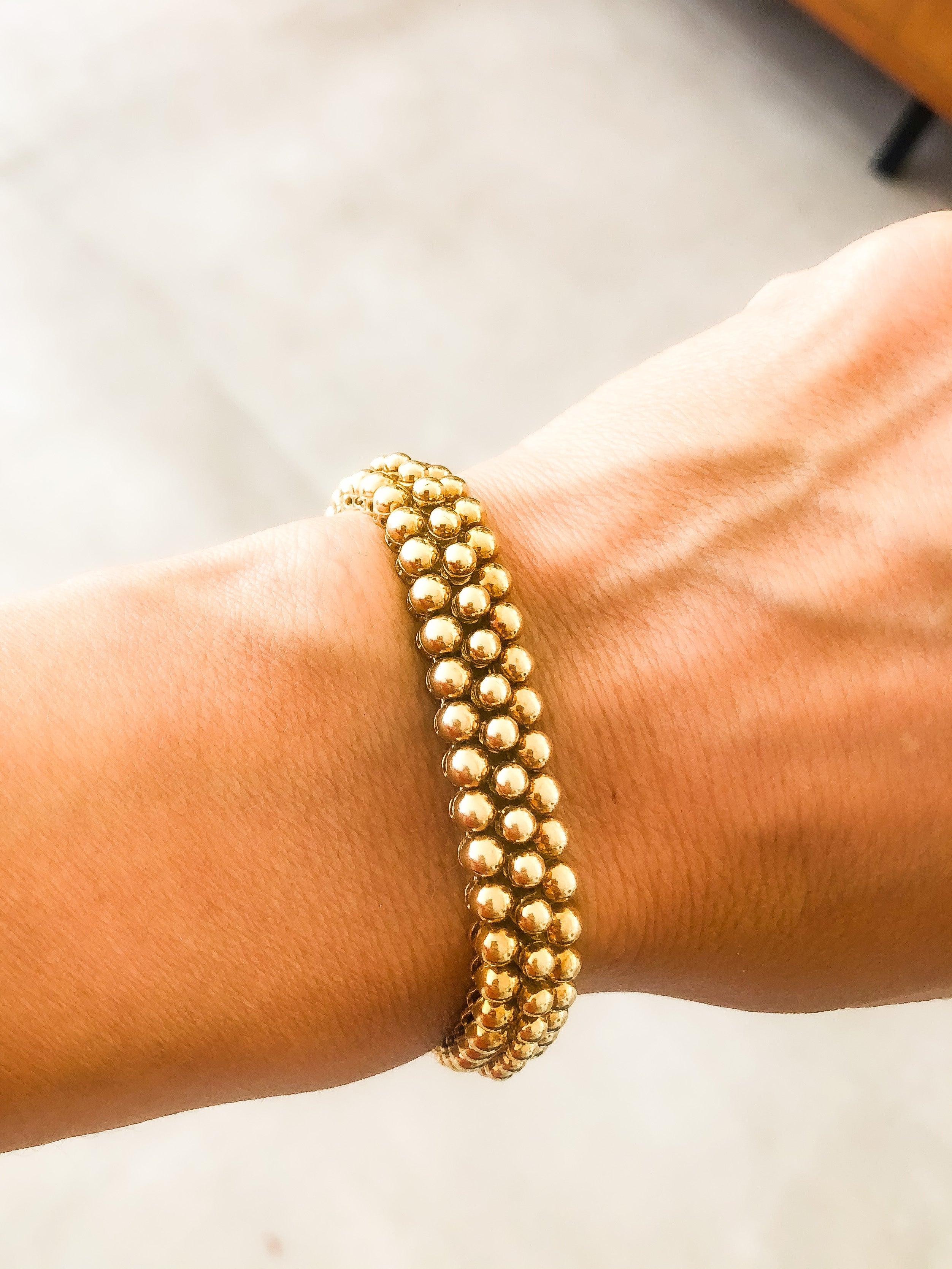 Bracelet or jaune 18k signé et numéroté de la maison Boucheron collection Grains de Raisin