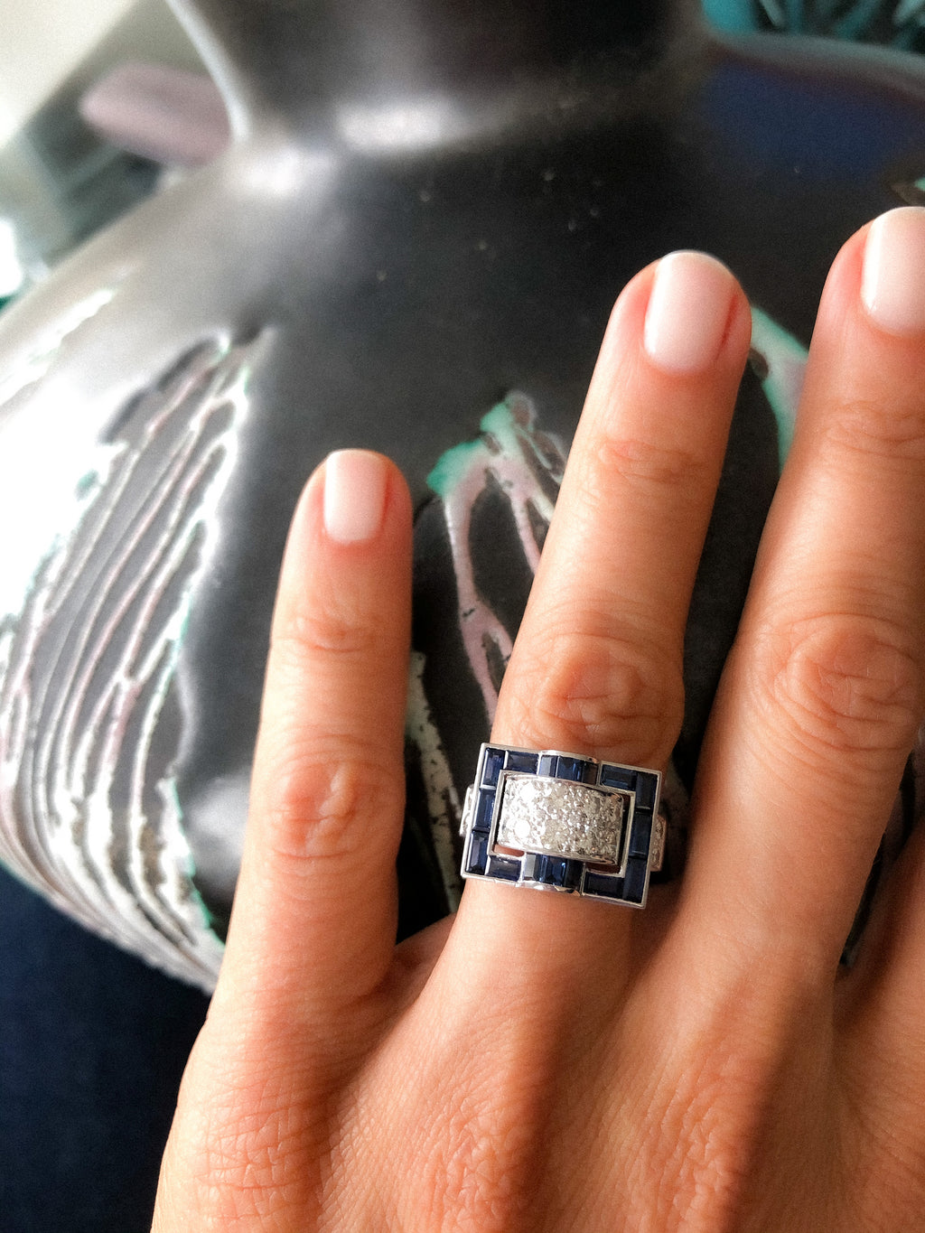 White gold ring with calibrated blue sapphires