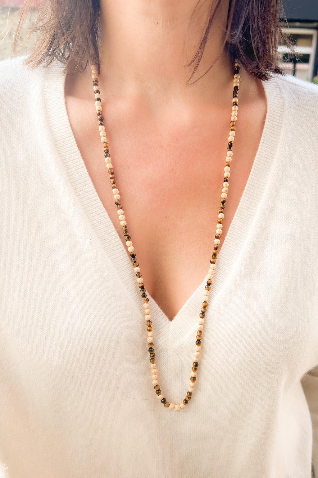 Sautoir necklace in sandblasted yellow gold and tiger's eye pearl