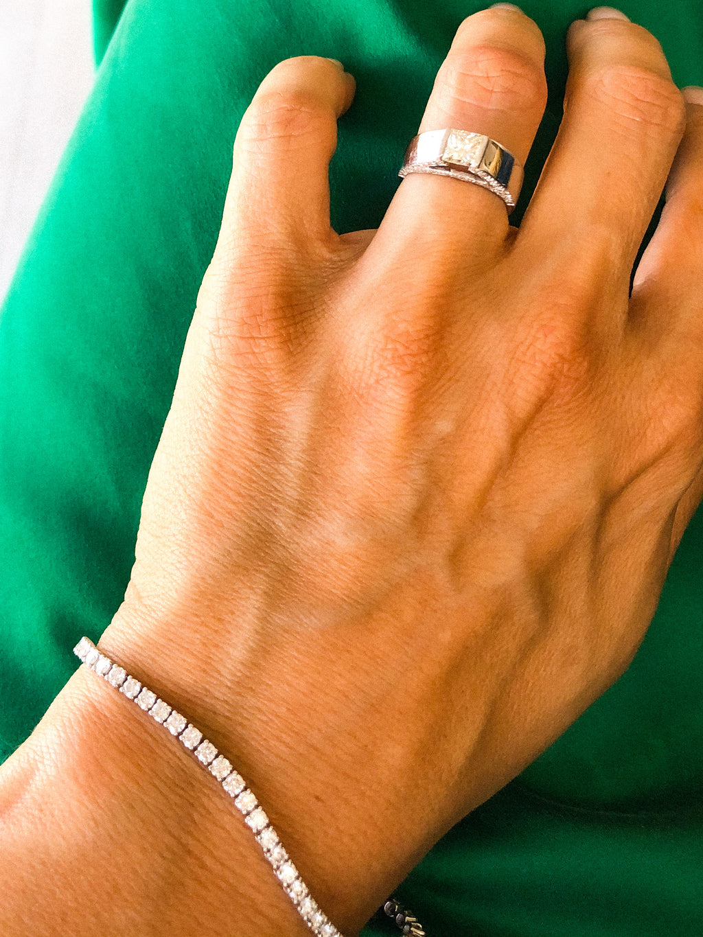 White gold solitaire ring with a princess-cut diamond