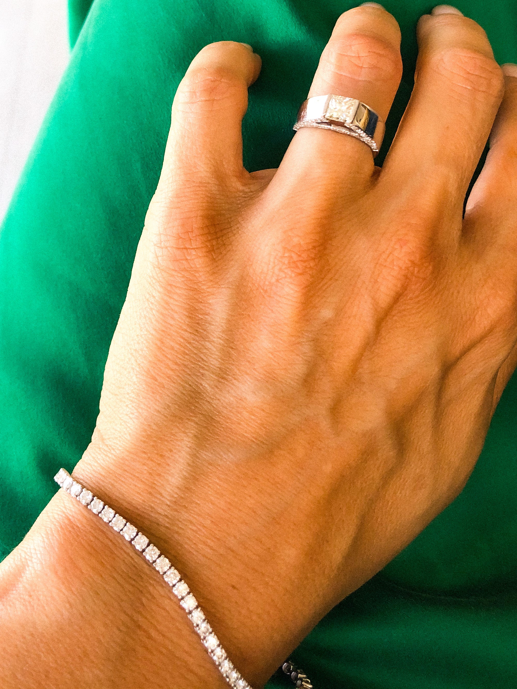 White gold solitaire ring with a princess-cut diamond