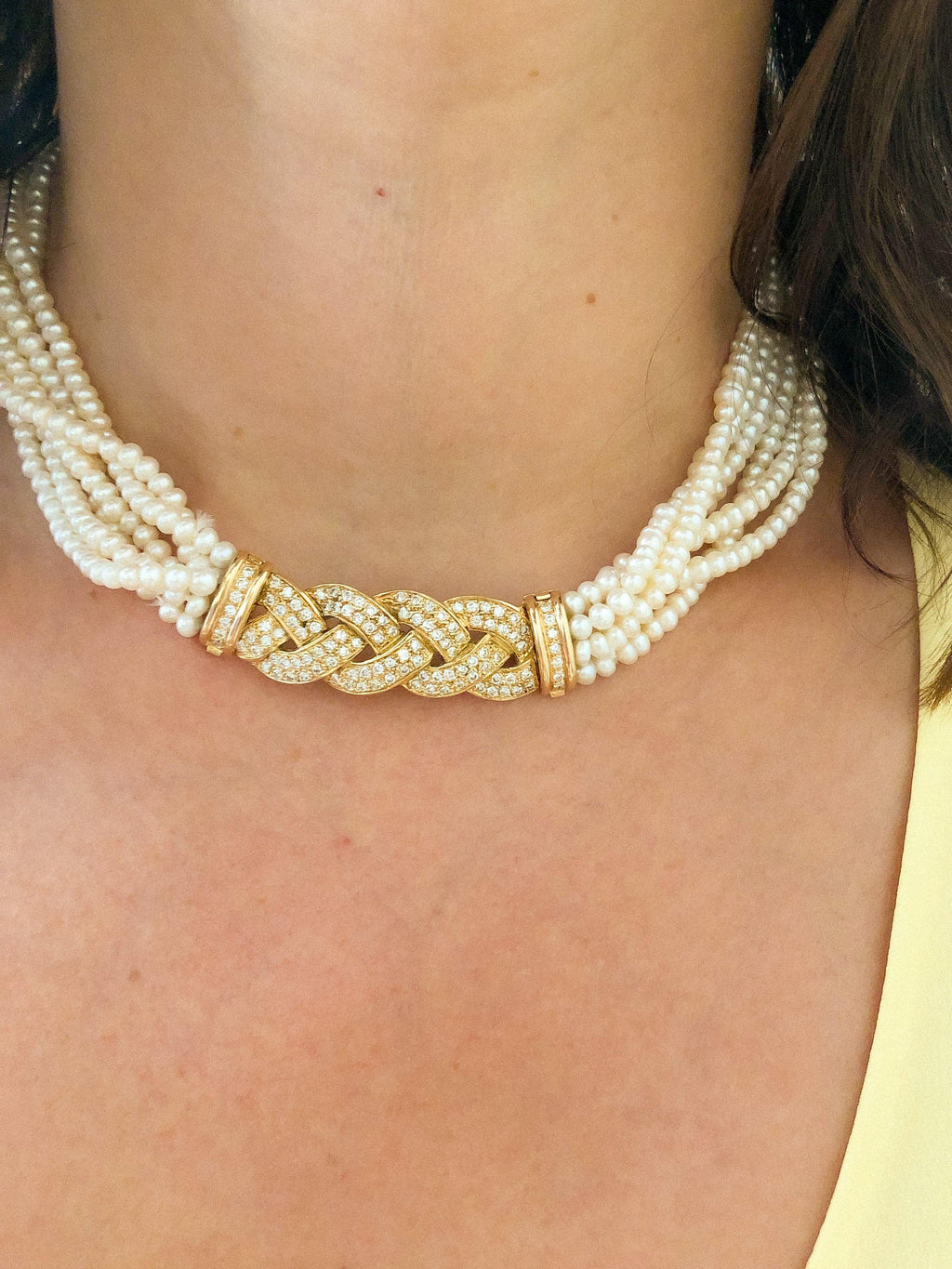 Multi-strand pearl necklace with diamond clasp