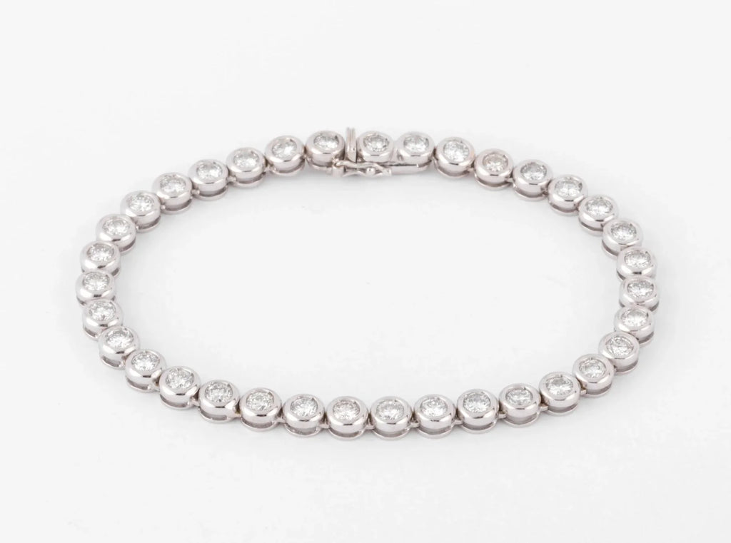 Bracelet en or gris et diamants tennis serti tennis