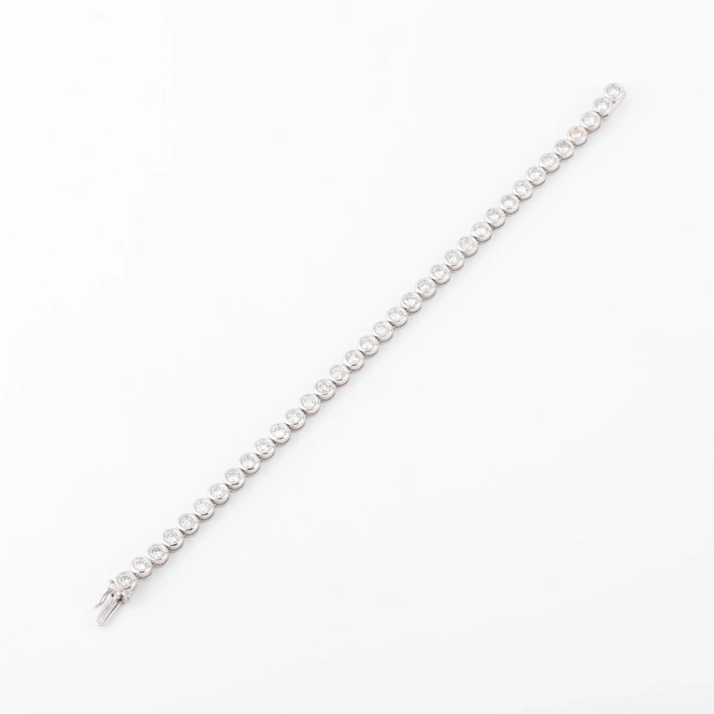 Bracelet en or gris et diamants tennis serti tennis