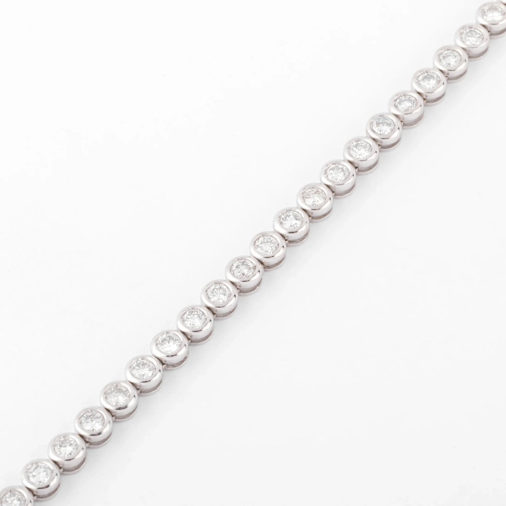 Bracelet en or gris et diamants tennis serti tennis