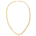 Yellow gold necklace adorned with a barrel clasp