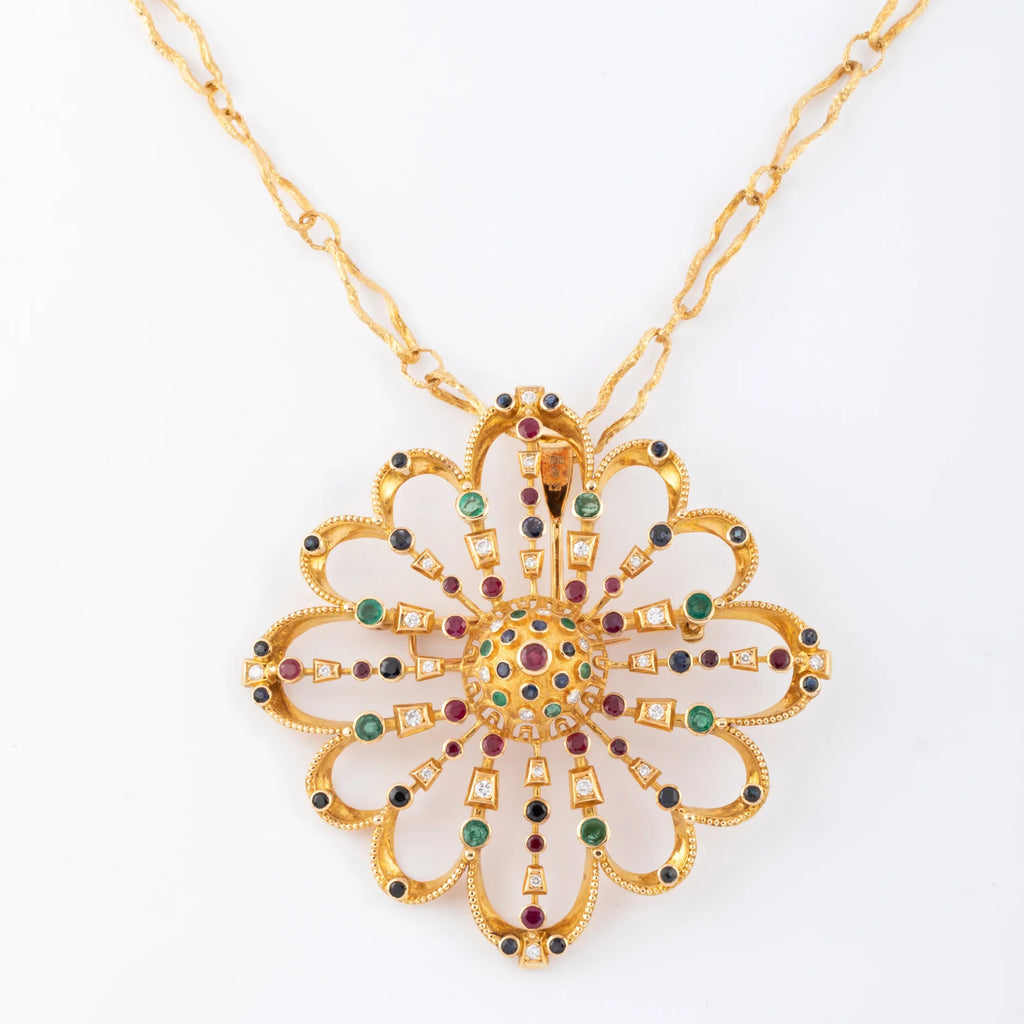 Pendentif et broche or jaune du créateur grec Lalaounis ornée de pierres précieuses