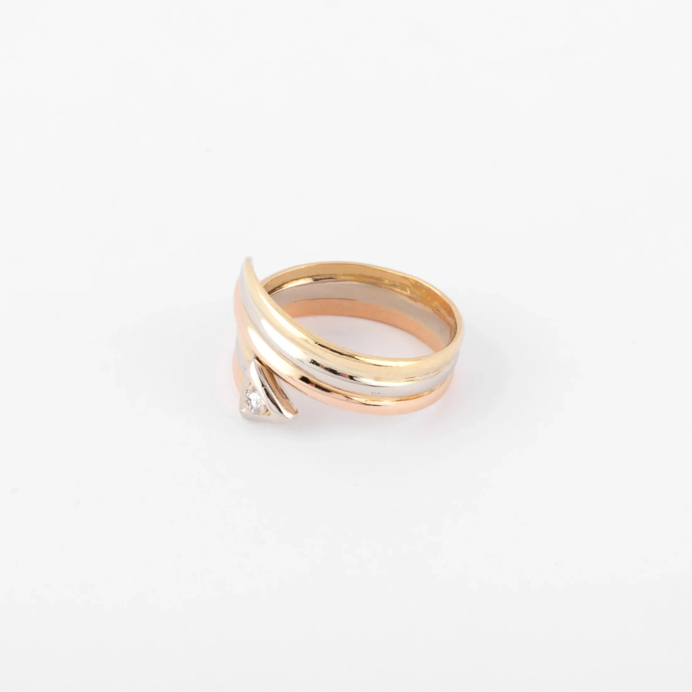 Three-gold ring with a diamond