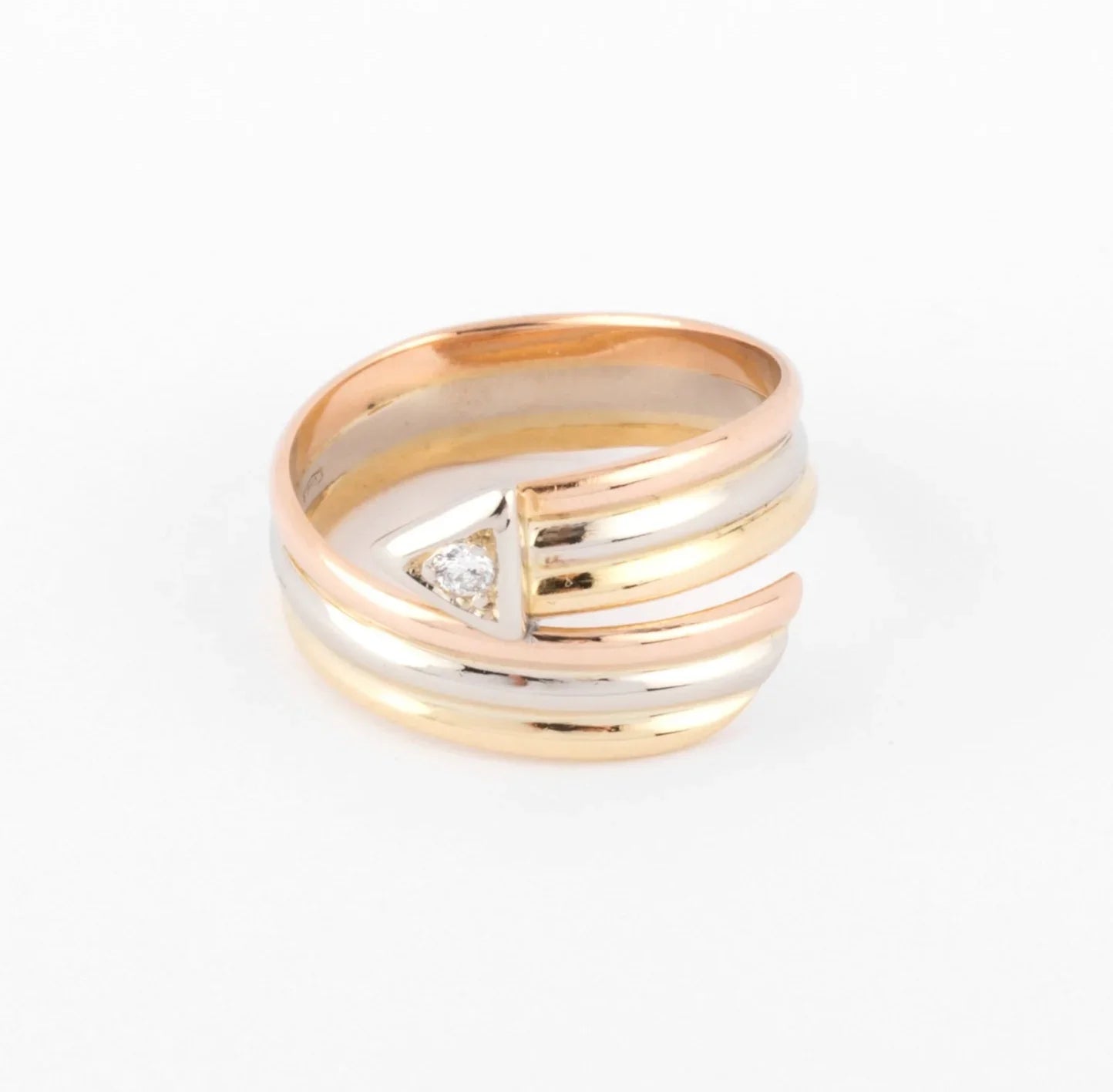 Three-gold ring with a diamond