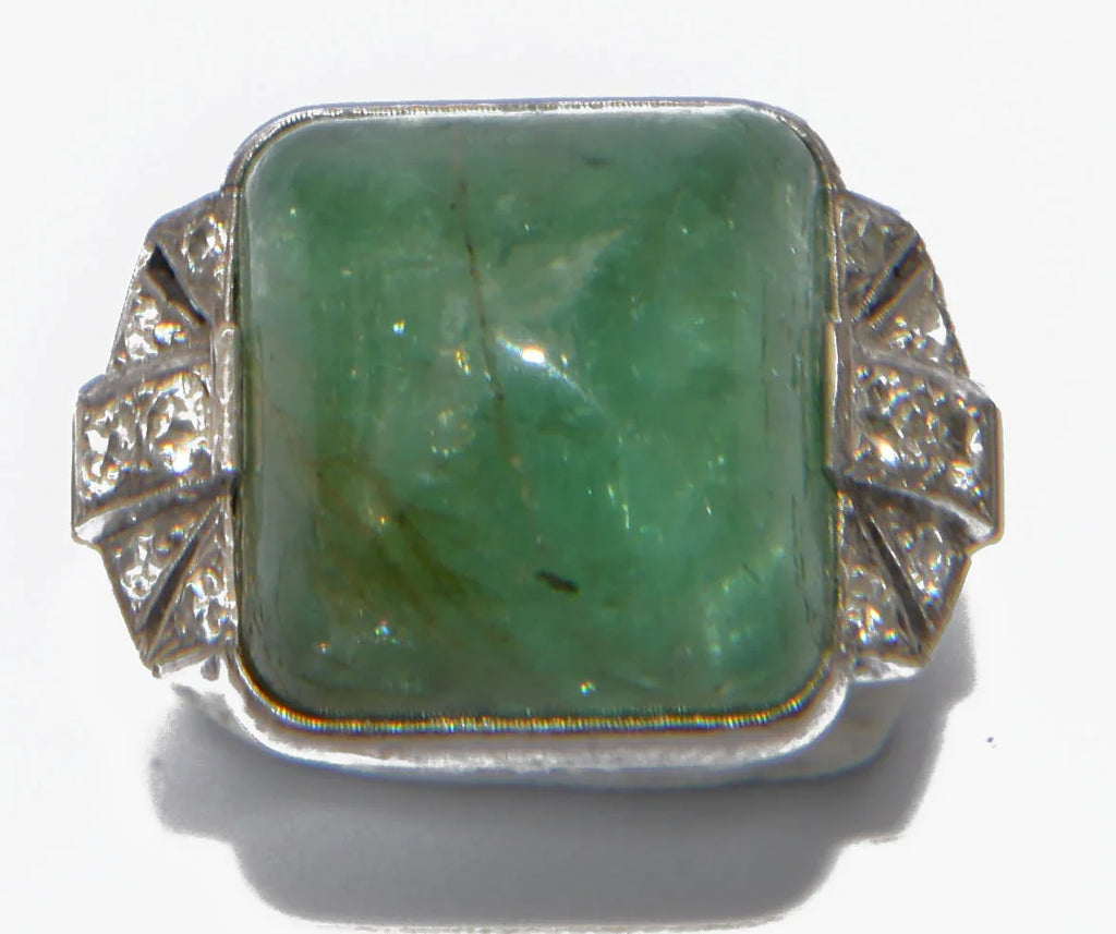 Platinum and sugarloaf emerald ring