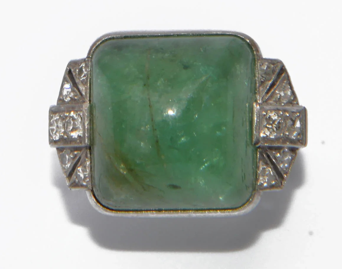 Platinum and sugarloaf emerald ring