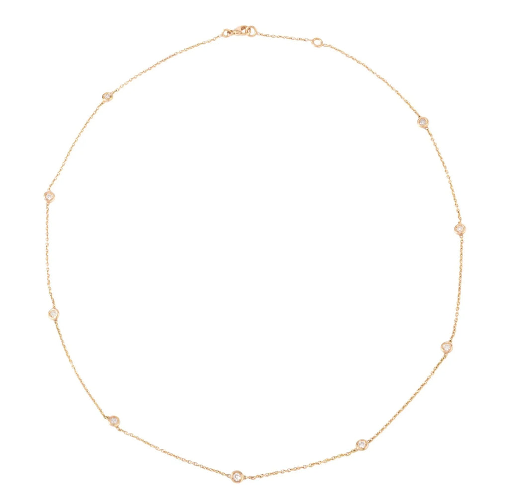 Yellow gold necklace with diamond-set links on a cable chain