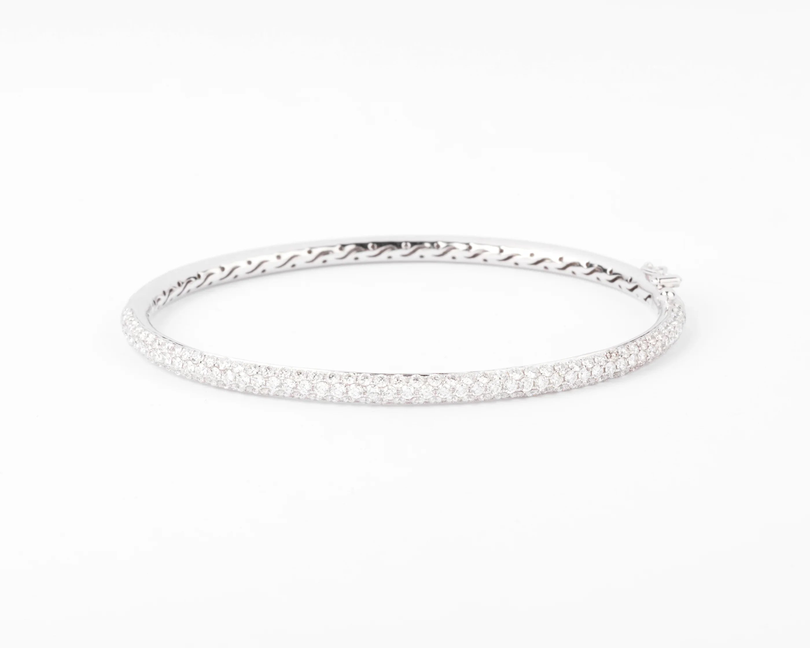 White gold bangle bracelet set with 3 rows of diamonds
