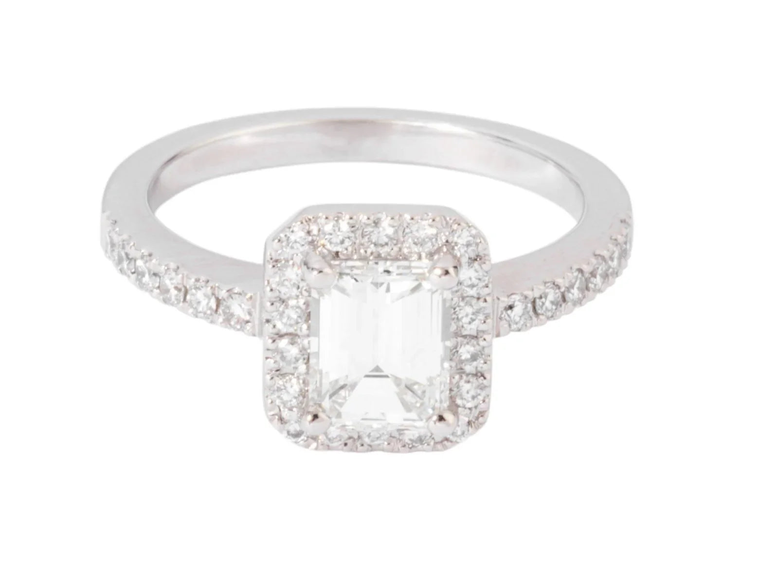 White gold solitaire ring with an emerald-cut diamond