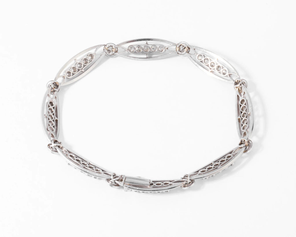 Platinum and diamond bracelet forming oval links