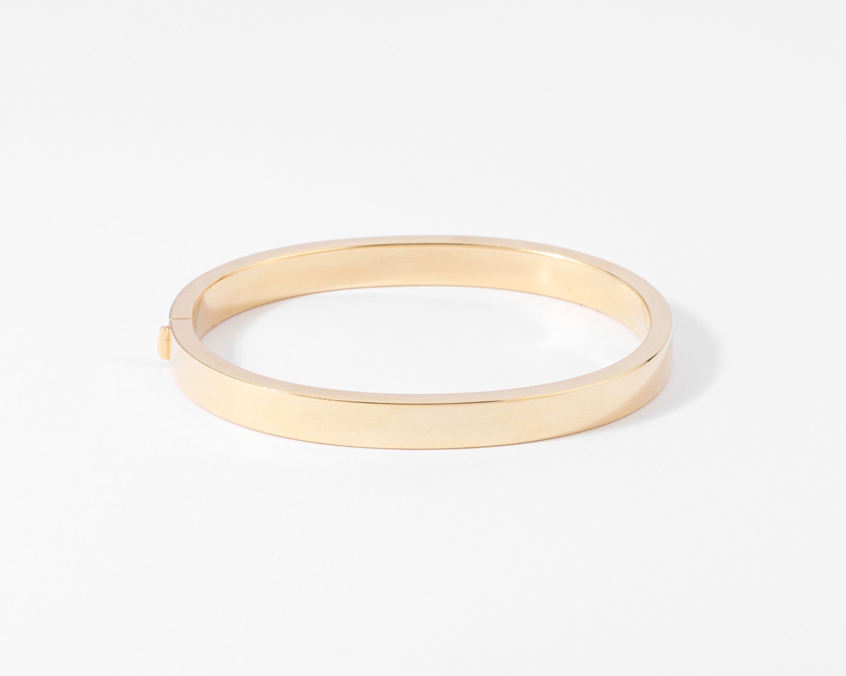 Yellow gold and diamond hinged bangle bracelet